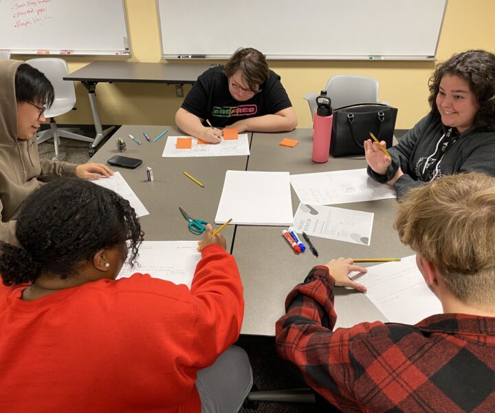 Digital Corps Fall 2022 new hires working hard on their collaboration skills during an onboarding activity.