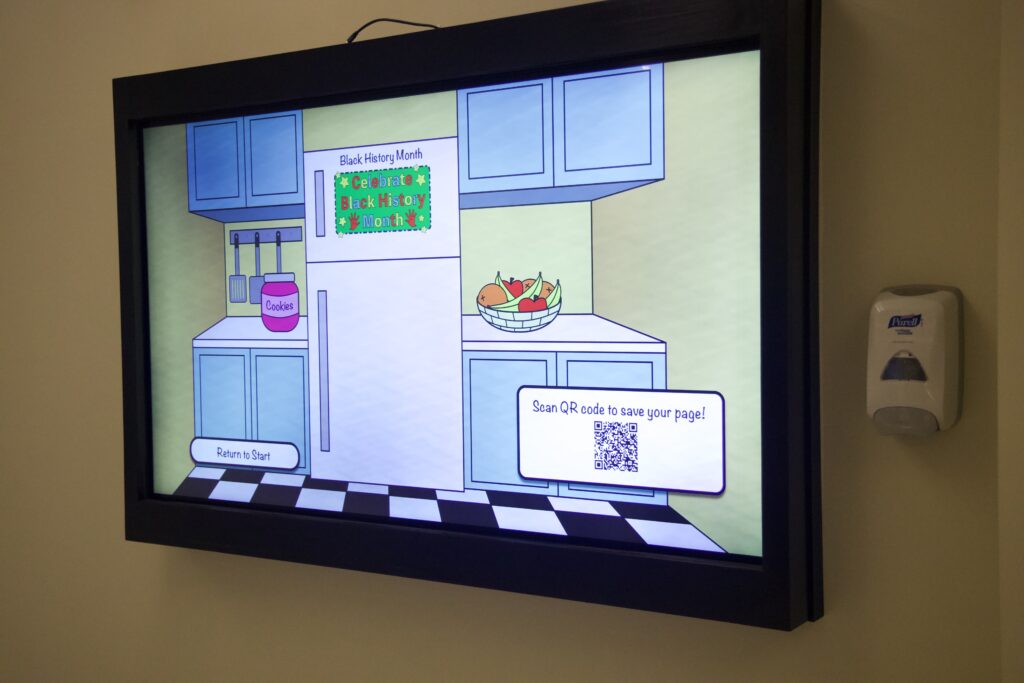 A picture of the MUTT Board displaying a kitchen design. There is a "Celebrate Black History Month" card on a refrigerator.